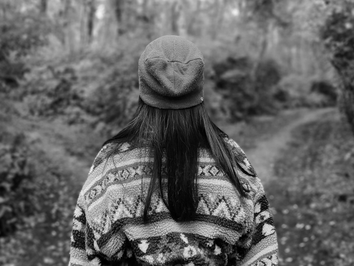 Girl standing at a fork in the road